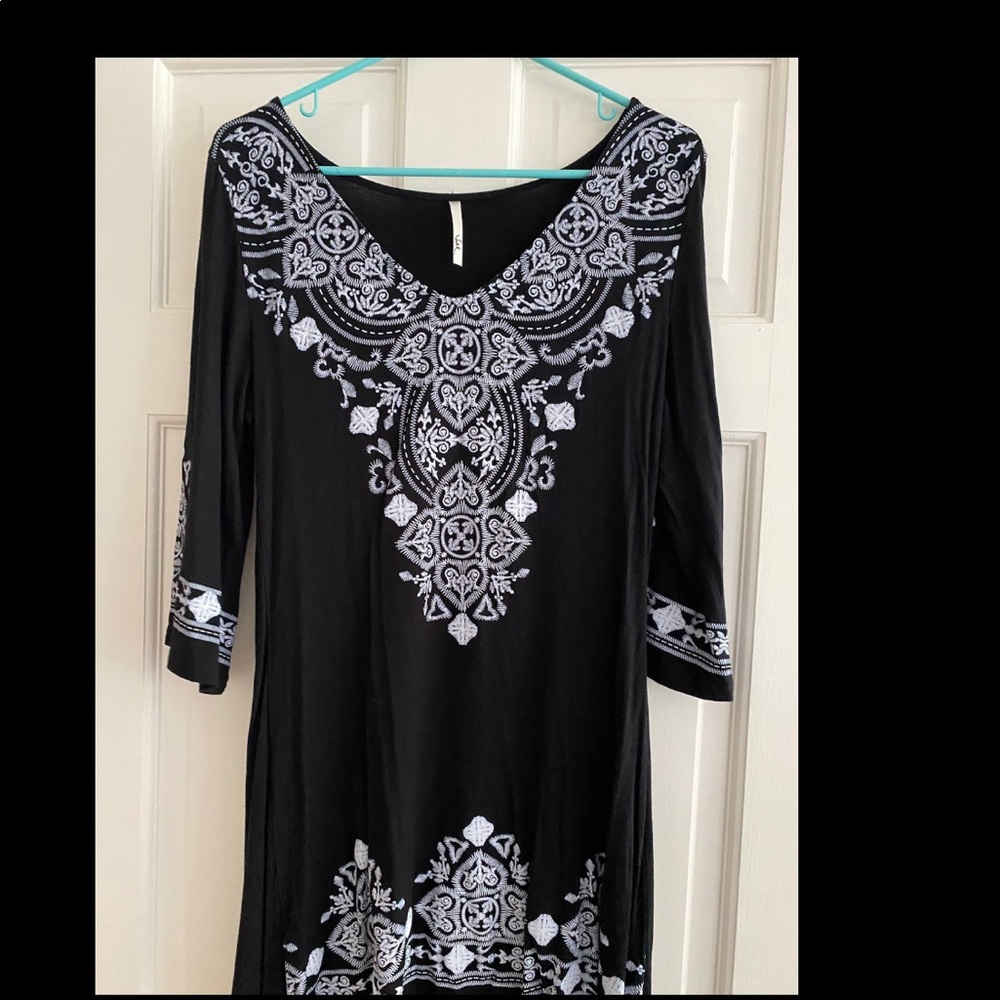 Black dress with white detail.